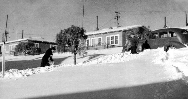 Josie and Bill Reinhart  shoveling snow HH